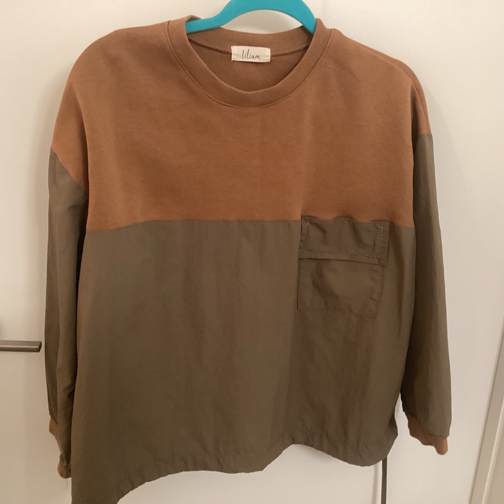 Lilium Brown Crew Neck Top with a synchable waist.
